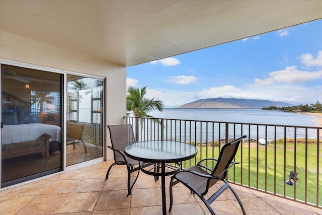 balcony with a water and mountain view