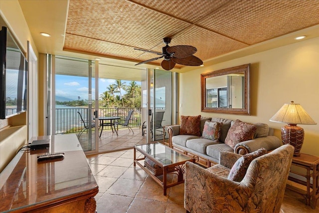 sunroom with ceiling fan and wood ceiling