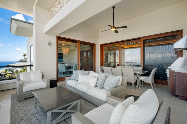 view of patio with outdoor lounge area, a water view, outdoor dining space, and a ceiling fan