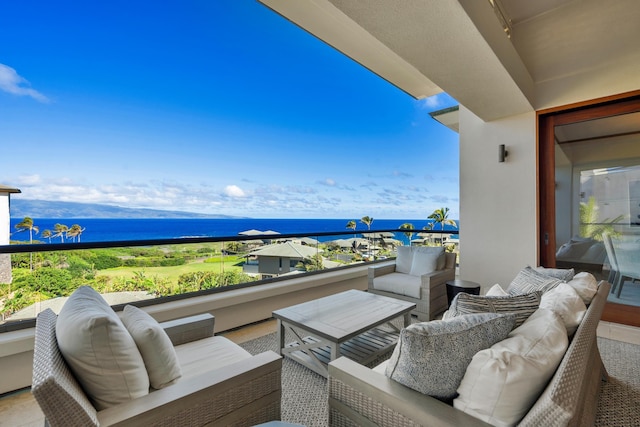 balcony featuring a sunroom, a water view, and an outdoor living space