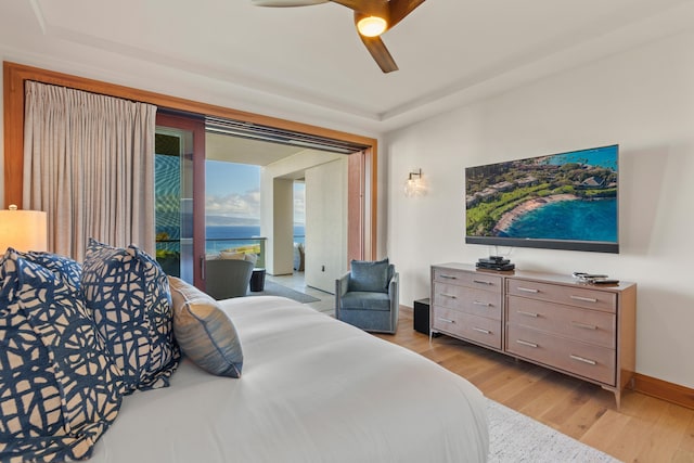 bedroom featuring a ceiling fan, access to exterior, baseboards, and light wood finished floors