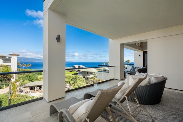 balcony featuring a water view