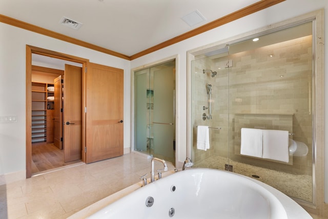 bathroom featuring ornamental molding, visible vents, a shower stall, and baseboards