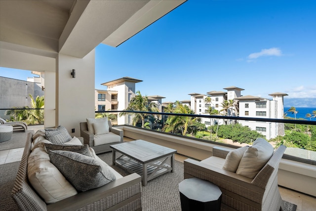 balcony featuring an outdoor hangout area and a water view