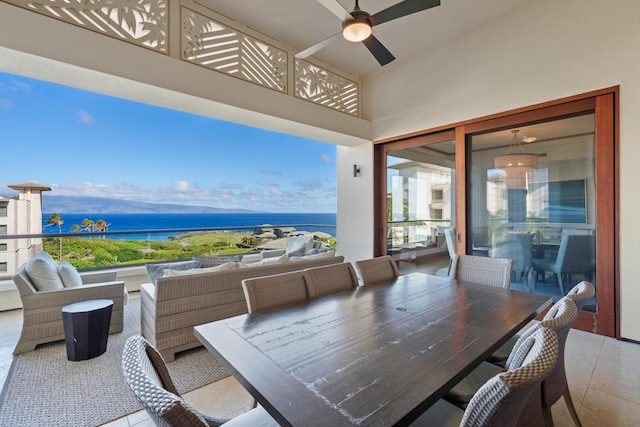 interior space featuring a water view, ceiling fan, outdoor dining area, and an outdoor living space