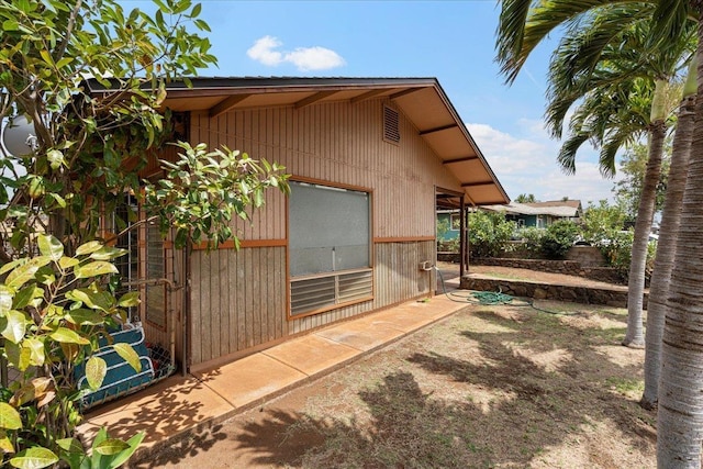 view of property exterior featuring a patio area
