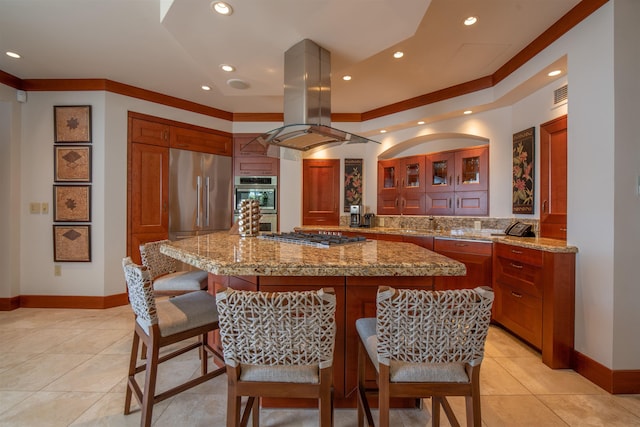 3800 Wailea Alanui Dr Unit B-102, Kihei, HI 96753 - kitchen with island range hood, stainless steel appliances, baseboards, light tile patterned floors, and crown molding