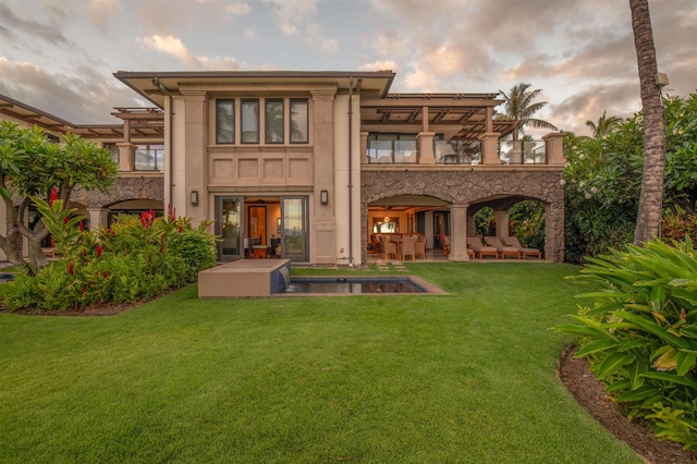 3800 Wailea Alanui Dr Unit B-102, Kihei, HI 96753 - back of property with a yard, a patio area, a pergola, an outdoor pool, and a balcony
