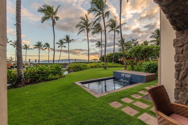 3800 Wailea Alanui Dr Unit B-102, Kihei, HI 96753 - yard at dusk featuring a yard and a water view