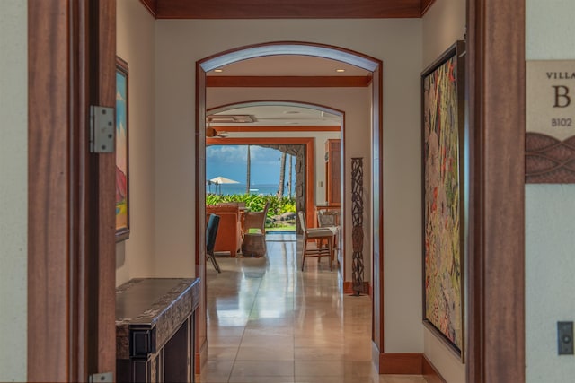 3800 Wailea Alanui Dr Unit B-102, Kihei, HI 96753 - hallway featuring baseboards, arched walkways, ornamental molding, and light tile patterned floors