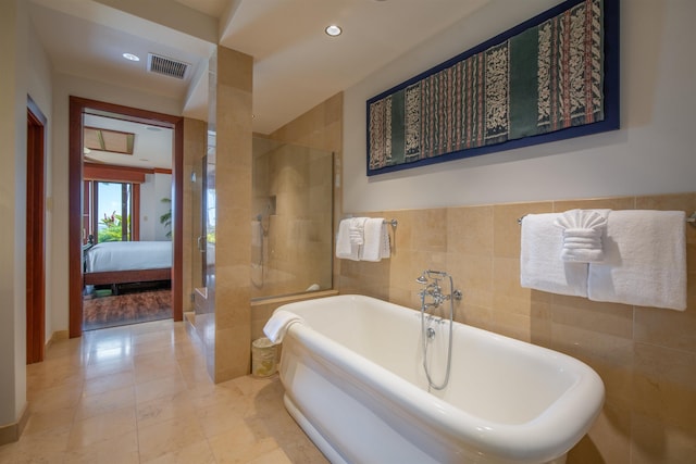 3800 Wailea Alanui Dr Unit B-102, Kihei, HI 96753 - bathroom featuring connected bathroom, tile walls, a freestanding bath, tiled shower, and recessed lighting