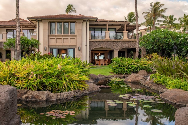 3800 Wailea Alanui Dr Unit B-102, Kihei, HI 96753 - rear view of property with a balcony, stucco siding, and a garden pond