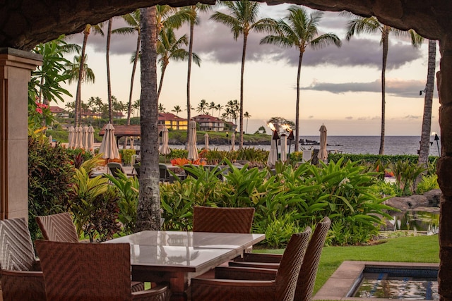 3800 Wailea Alanui Dr Unit B-102, Kihei, HI 96753 - patio terrace at dusk with a water view and outdoor dining area