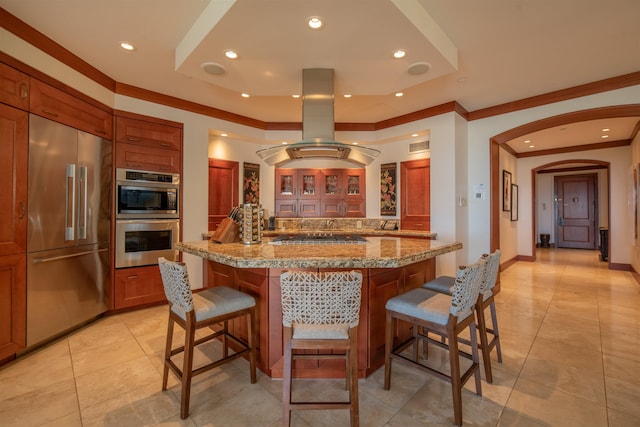 3800 Wailea Alanui Dr Unit B-102, Kihei, HI 96753 - kitchen featuring stainless steel appliances, ornamental molding, a kitchen bar, island range hood, and light tile patterned floors