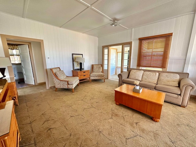 carpeted living room featuring plenty of natural light, french doors, and ceiling fan