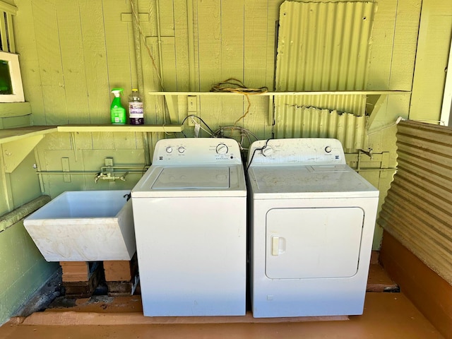 washroom featuring sink and separate washer and dryer