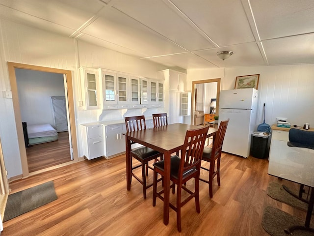 dining space with light hardwood / wood-style flooring