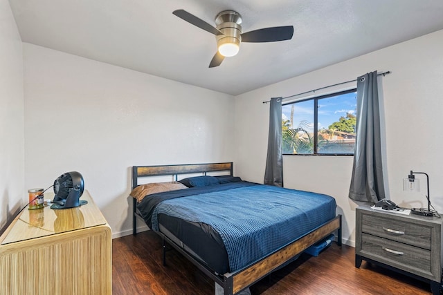 bedroom with ceiling fan and dark hardwood / wood-style flooring