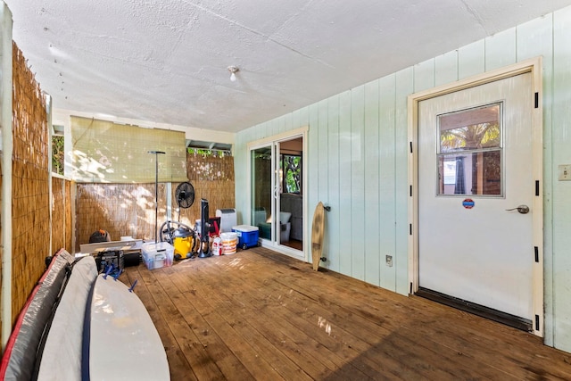 interior space featuring wood-type flooring and a textured ceiling