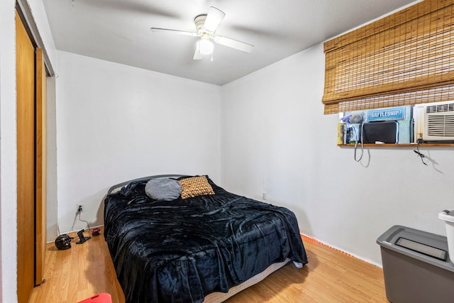 bedroom featuring ceiling fan and wood-type flooring