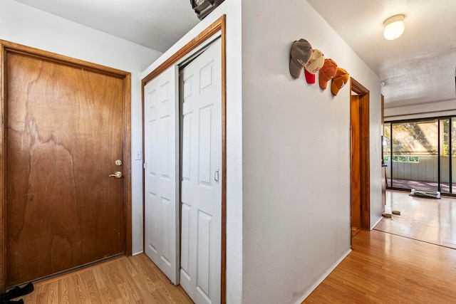 hallway with light wood-type flooring