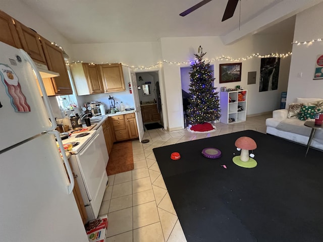 kitchen with ceiling fan, white fridge, stove, and light tile patterned floors