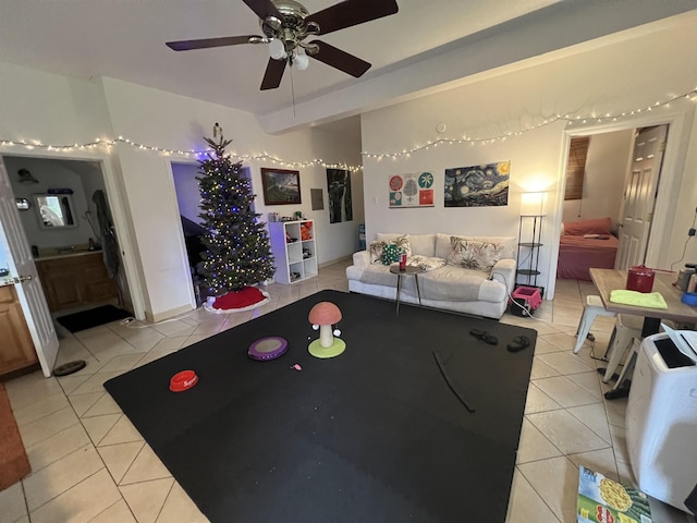 recreation room featuring light tile patterned floors and ceiling fan