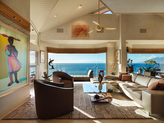 living room featuring carpet flooring, ceiling fan, a water view, and high vaulted ceiling