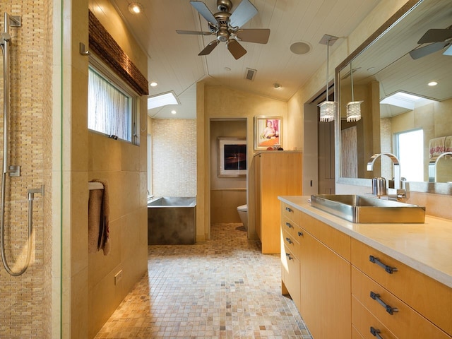 bathroom featuring vanity, lofted ceiling, toilet, tile walls, and walk in shower