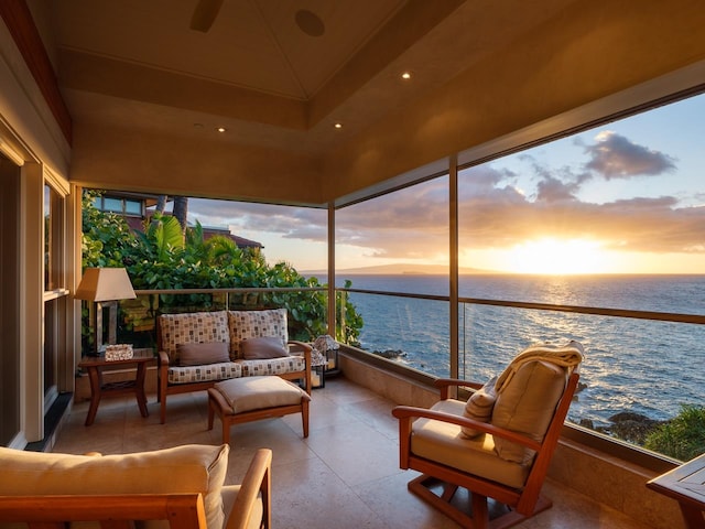 sunroom / solarium with a water view