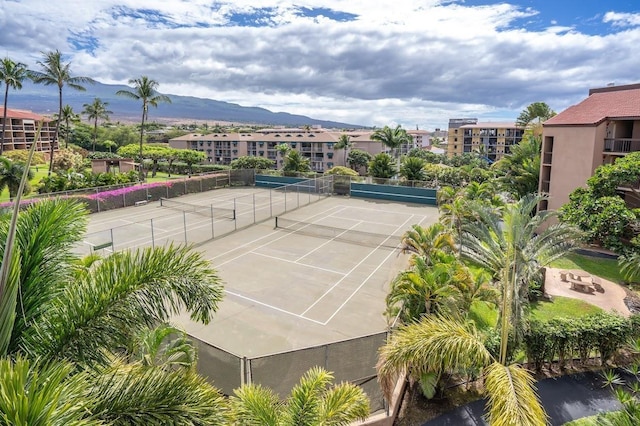 view of sport court with a mountain view