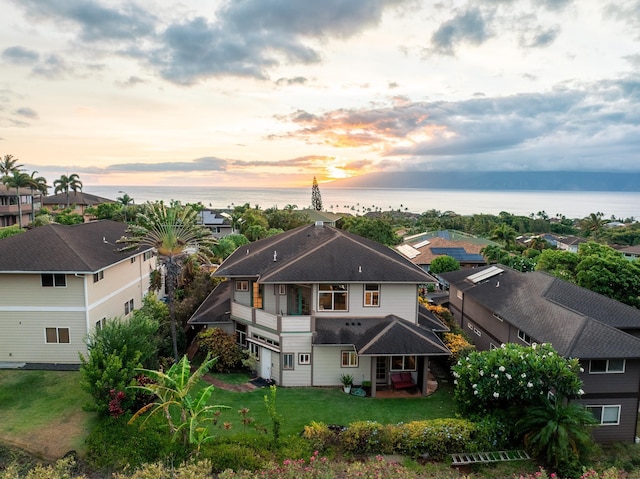 140 Kahana Ridge Dr, Lahaina, HI 96761 - rear view of house with a water view, a lawn, a balcony, and a shingled roof