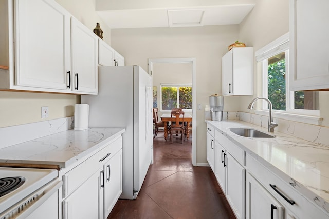 140 Kahana Ridge Dr, Lahaina, HI 96761 - kitchen featuring plenty of natural light, white cabinetry, dark tile patterned floors, and white appliances