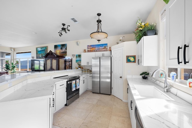 140 Kahana Ridge Dr, Lahaina, HI 96761 - kitchen with freestanding refrigerator, range with electric cooktop, light stone countertops, and a peninsula