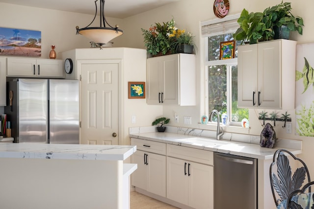 140 Kahana Ridge Dr, Lahaina, HI 96761 - kitchen with stainless steel appliances, plenty of natural light, light stone counters, and white cabinetry