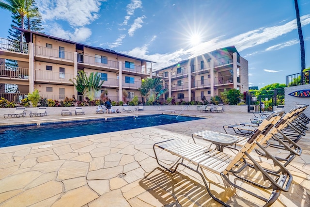 view of swimming pool with a patio