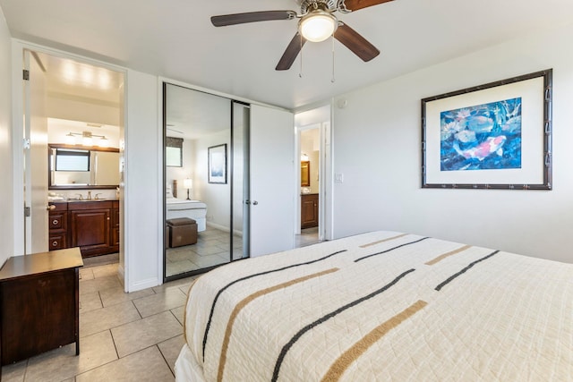 2653 S Kihei Rd Unit 306, Kihei, HI 96753 - bedroom with light tile patterned flooring, ensuite bath, a sink, a closet, and ceiling fan