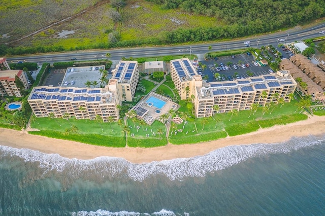 aerial view featuring a water view and a beach view