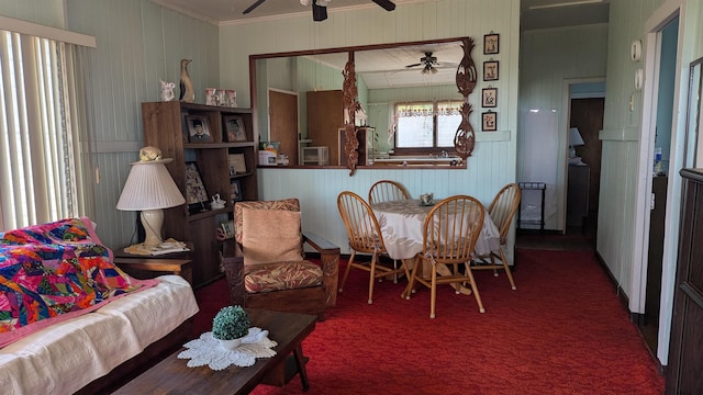 dining area with carpet flooring and ceiling fan