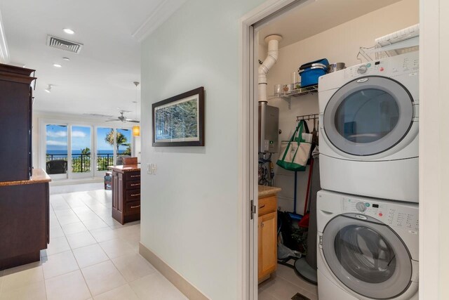 161 Wailea Ike Pl Unit C204, Kihei, HI 96753 - laundry area with stacked washer / drying machine, light tile patterned floors, ceiling fan, baseboards, and recessed lighting