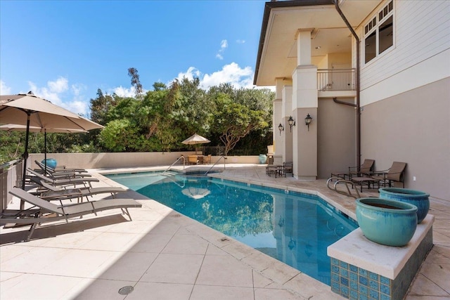 view of pool featuring a fenced in pool and a patio area