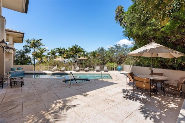 view of swimming pool featuring a patio, fence, and a fenced in pool