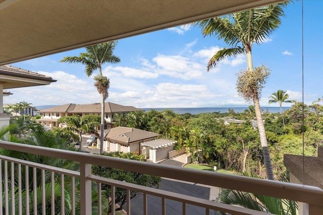 balcony featuring a water view