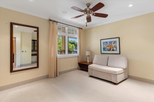 living area featuring ornamental molding, ceiling fan, and light tile patterned floors