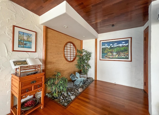 sitting room with wood ceiling and hardwood / wood-style flooring