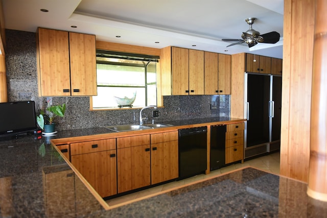 kitchen featuring tasteful backsplash, sink, light tile patterned flooring, black dishwasher, and paneled built in refrigerator