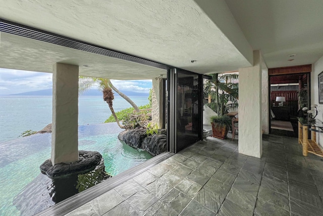 interior space featuring a water and mountain view