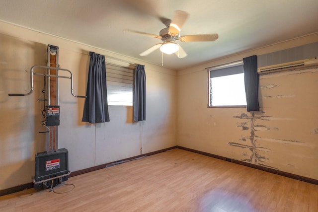 unfurnished room with ceiling fan and light hardwood / wood-style flooring