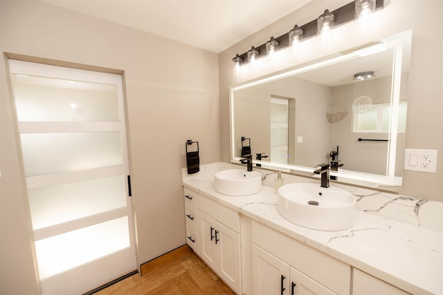 bathroom featuring double vanity and a sink