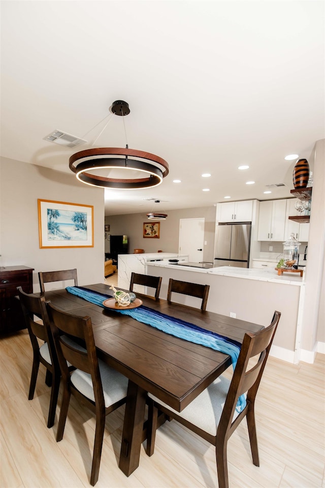 dining space featuring visible vents and recessed lighting